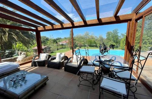 Liano Villa | Relax at El Palacio de Liaño: Poolside BBQ & Ocean Views