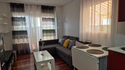 Mogro Apartment | El Pinar de Mogro: Poolside Relaxation & Family Fun
