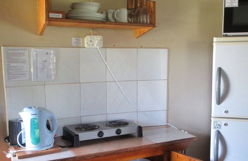 Dullstroom Cabin | Tranquil Elandskloof Trout Farm with Spa & Hot Tub Amenities