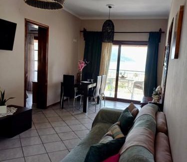 Agios Georgios Pagon Apartment | Experience Eleana Apartments with Oceanfront Views