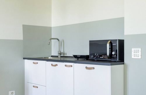 San Fermo della Battaglia Apartment | Chic Apartment in Spina Verde, Steps from Lake Como