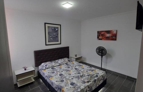 Melgar Apartment | Elegant Comfort and Poolside Relaxation Awaits You