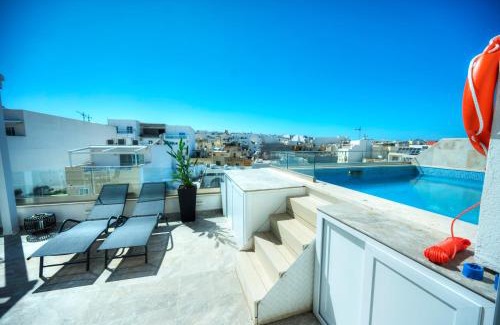 Tal-Ibrag Apartment | Stylish 2-Bedroom Retreat with Pool and Sunny Terrace