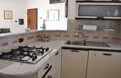 Portoscuso Apartment | Stylish Apartment with Ocean View in the City Center