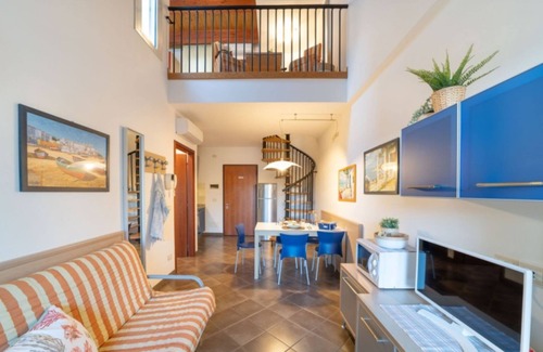 Bibione Apartment | Elegant duplex apartment with shared pool