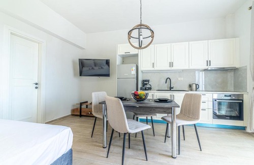 Agios Dimitrios Apartment | Cozy Suite 1 Steps from the Beach - Family Friendly Stay