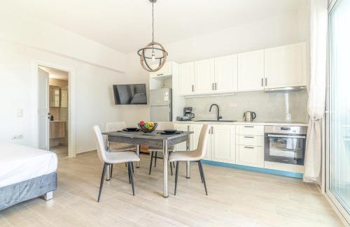 Agios Dimitrios Apartment | Cozy Suite 1 Steps from the Beach - Family Friendly Stay