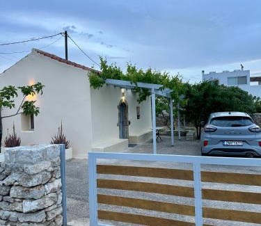 Friligkianika House | Elia Houses - Traditional Retreat with Pet-Friendly Backyard