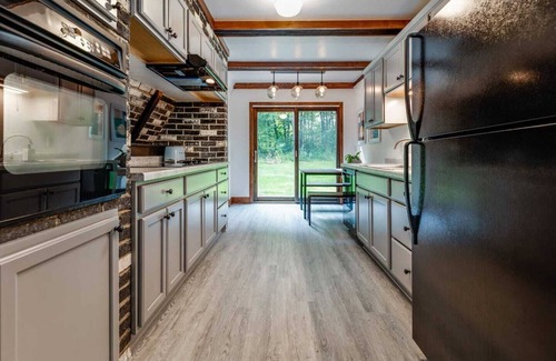 Elkhart Lake Cabin | Discover Elkhart A-Frame: Wooded Retreat with Pool & Spa
