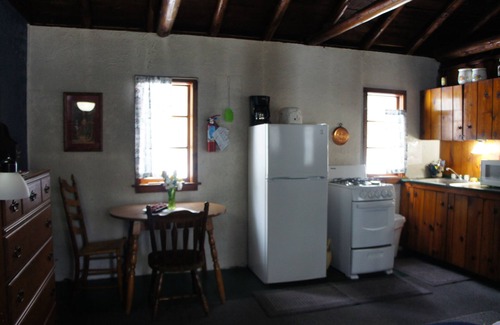Grawn Cabin | Relaxing Ellis Lake Resort Elm Log Cabin with Spa & Hot Tub