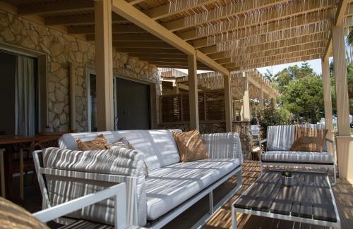 Agios Theodoros Apartment | Experience Elya Beach Suites: Oceanfront with Pool & Dining