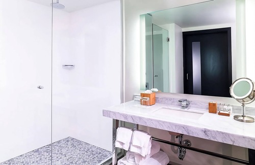 West Plaza Hotel | Romantic Getaway with Pool Access and Pet-Friendly Comfort