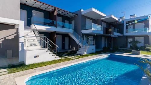 Paralia Ofryniou Apartment | Discover Emerald Suites with Pool & Dining – 10/10 Rated!