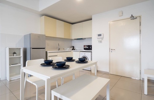 The Strand Hotel | Modern Encorp Strand Residences: Pool, Spa & Dining Await
