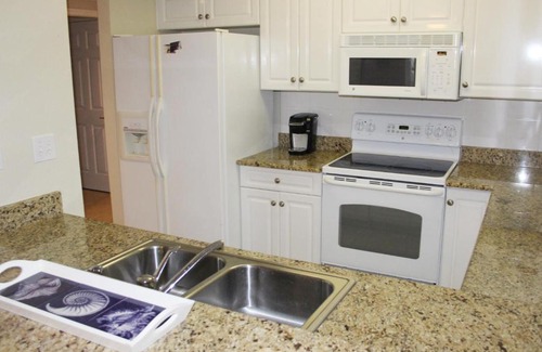 New Smyrna Beach Apartment | Experience Breathtaking Sunsets at Estuary Retreat OW10-403