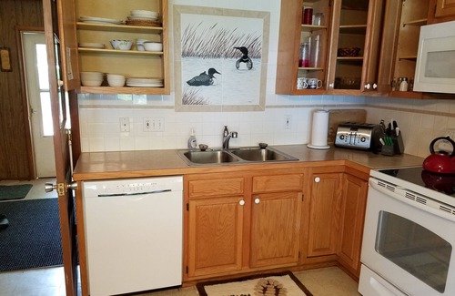 Williamsburg Cottage | Beachfront Retreat on Lake Skegemog with Dock & Pool