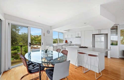Forresters Beach House | Relax on the Seabreezing Deck with Oceanfront Views