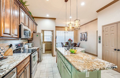 Rowlett House | Enjoy the peace and quiet back patio with Lagoon pool.