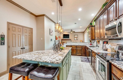Rowlett House | Enjoy the peace and quiet back patio with Lagoon pool.