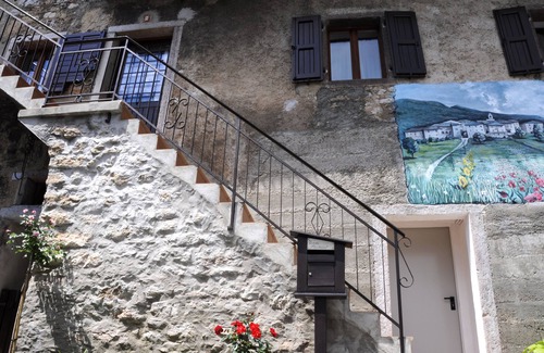Ranzo Apartment | Serene Mountain Retreat with Pool and Lake View Amenities