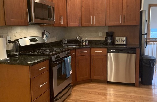 Allston Apartment | Top-Rated Two-Bed Rental with Parking and Breakfast Included