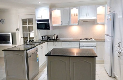 Forster House | Waterfront Retreat: Grand Riviera Forster with Pool & Views