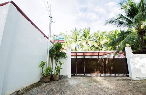 Tawala House | Entra Tourist Inn: Poolside Retreat with Ocean Views