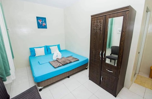 Tawala House | Entra Tourist Inn: Poolside Retreat with Ocean Views