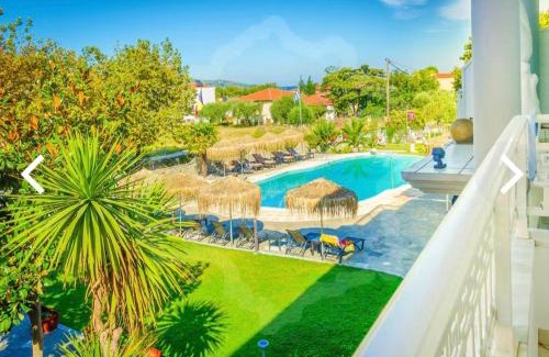 Chrisi Akti Apartment | Discover Eric's Apartment: Oceanfront Retreat with Pool