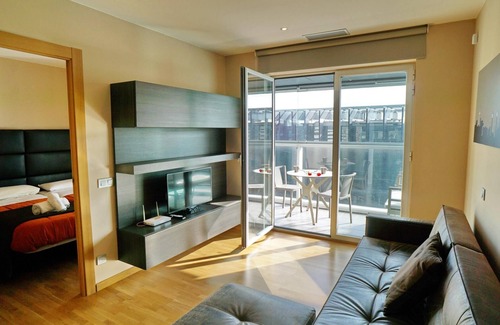 El Port Apartment | Elegant Apartment Steps from Fira Gran Via with Unique Amenities