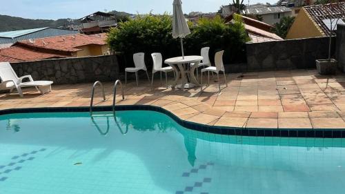 Praia dos Anjos House | Escape to Paradise: Poolside Oasis Steps from the Beach