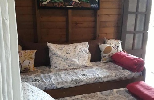 Praia do Rosa Ski Chalet | Essência da Terra: Family-Friendly Cabanas for Your Getaway