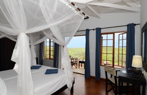 Okaukuejo Cabin | Experience Etosha Safari Lodge: Family-Friendly Retreat