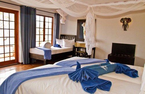 Okaukuejo Cabin | Experience Etosha Safari Lodge: Family-Friendly Retreat