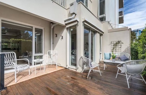 Port Melbourne Apartment | Exceptional Location on the park, the beach, gym, pool with a private garden.
