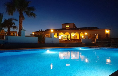 Lora Del Rio Ski Chalet | Elegant Chalet with Pool and Spa near Sevilla for 14 Guests