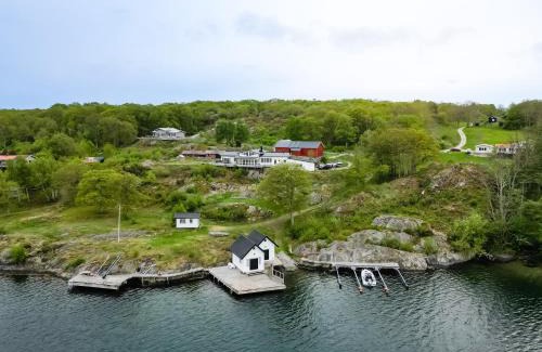 Nosund Villa | Exclusive House with Private Boathouse & Ocean Views