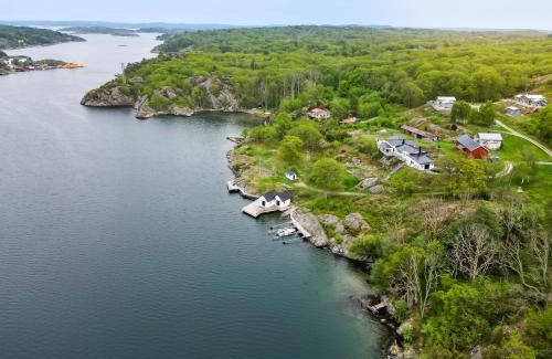 Nosund Villa | Exclusive House with Private Boathouse & Ocean Views