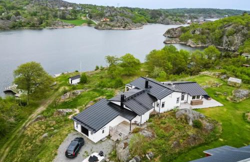 Nosund Villa | Exclusive House with Private Boathouse & Ocean Views