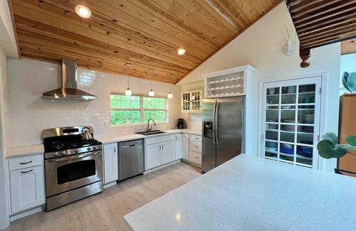 Powers Lake Villa | Exclusive Lakefront Retreat with Beach, Piers & More
