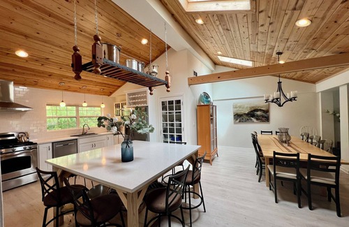 Powers Lake Villa | Exclusive Lakefront Retreat with Beach, Piers & More