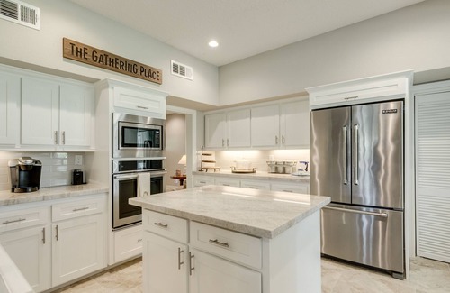 Dickinson House | Expansive home on the water with dock, large deck, shared pool & central AC