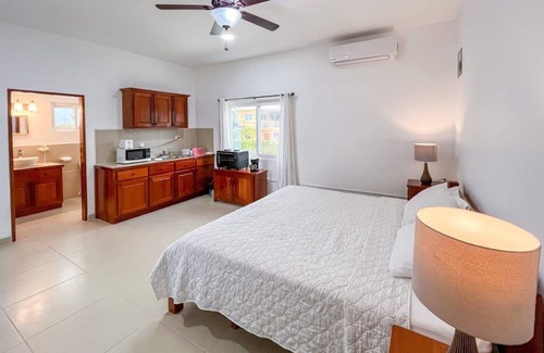 Caye Caulker Apartment | Picturesque Poolside Retreat with Spa and Family Amenities