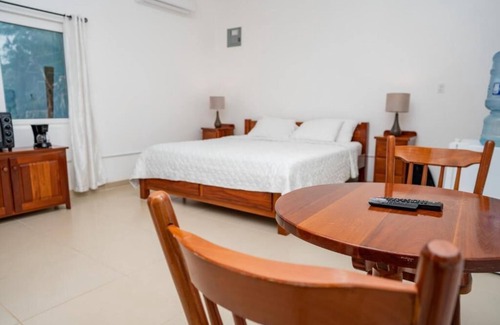 Caye Caulker Apartment | Picturesque Poolside Retreat with Spa and Family Amenities