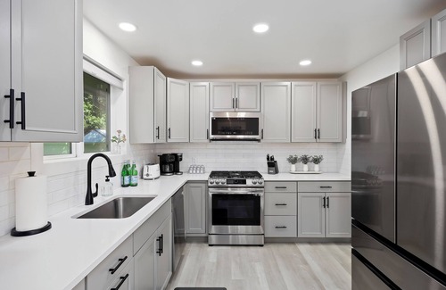 Burley House | Experience elevated comfort in this thoughtfully designed retreat. Featuring two inviting bedrooms, a fully equipped kitchen, and serene details, it blends simplicity with style for a clean, welcoming stay.