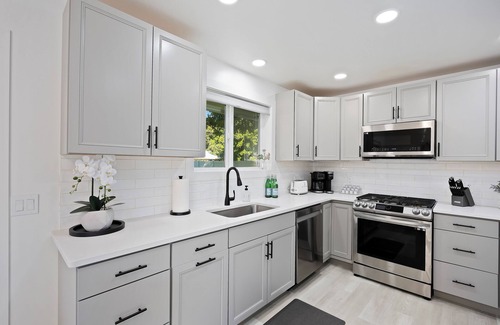 Burley House | Experience elevated comfort in this thoughtfully designed retreat. Featuring two inviting bedrooms, a fully equipped kitchen, and serene details, it blends simplicity with style for a clean, welcoming stay.