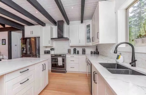Swansea Point House | Extraordinary home with pool,hot tub, sauna, gym, arcade & theatre.