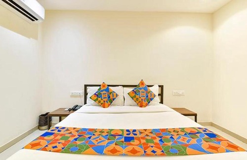 Surat Hotel | Comfortable FabHotel Happy Rooms with Breakfast & Accessibility