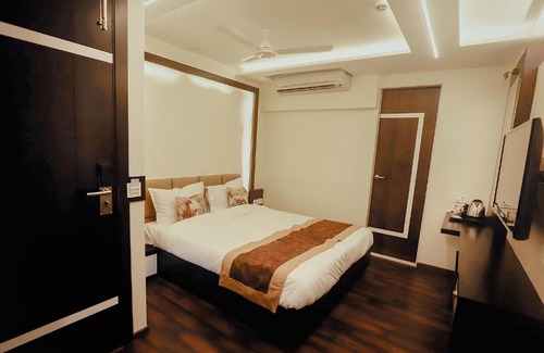 Maninagar Hotel | Guest Rated FabHotel Prime White Cloud with Breakfast & Fun
