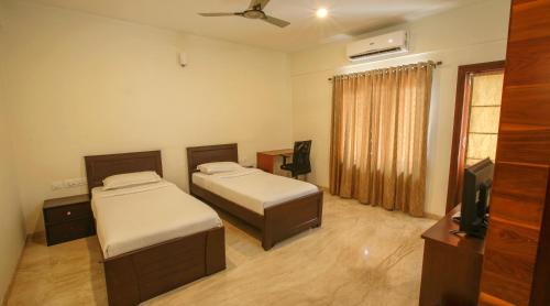 Yelahanka Bed & Breakfast | Modern Falcon Suites in Yelahanka with Great Amenities
